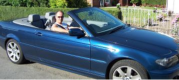 Me posing in Brian's BMW